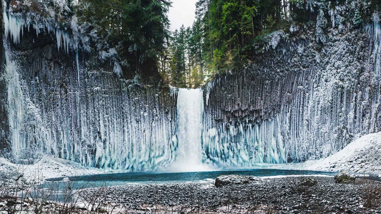 Frozen amphitheater of columnar basalt walls flanking Abiqua Falls, Oregon (© Joshua Meador/Tandem Stills + Motion) desktop wallpaper