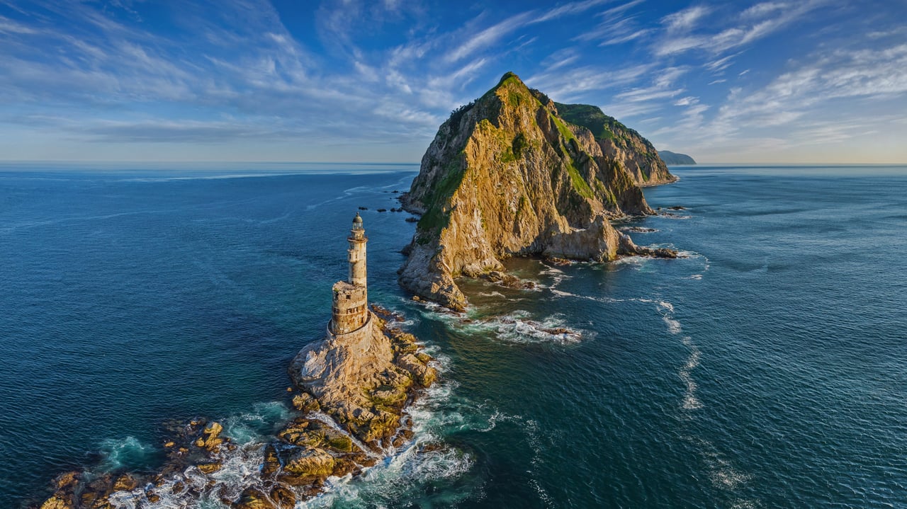 Lighthouse at Cape Aniva, Sakhalin Island, Russia (© Amazing Aerial Agency/Offset by Shutterstock) desktop wallpaper