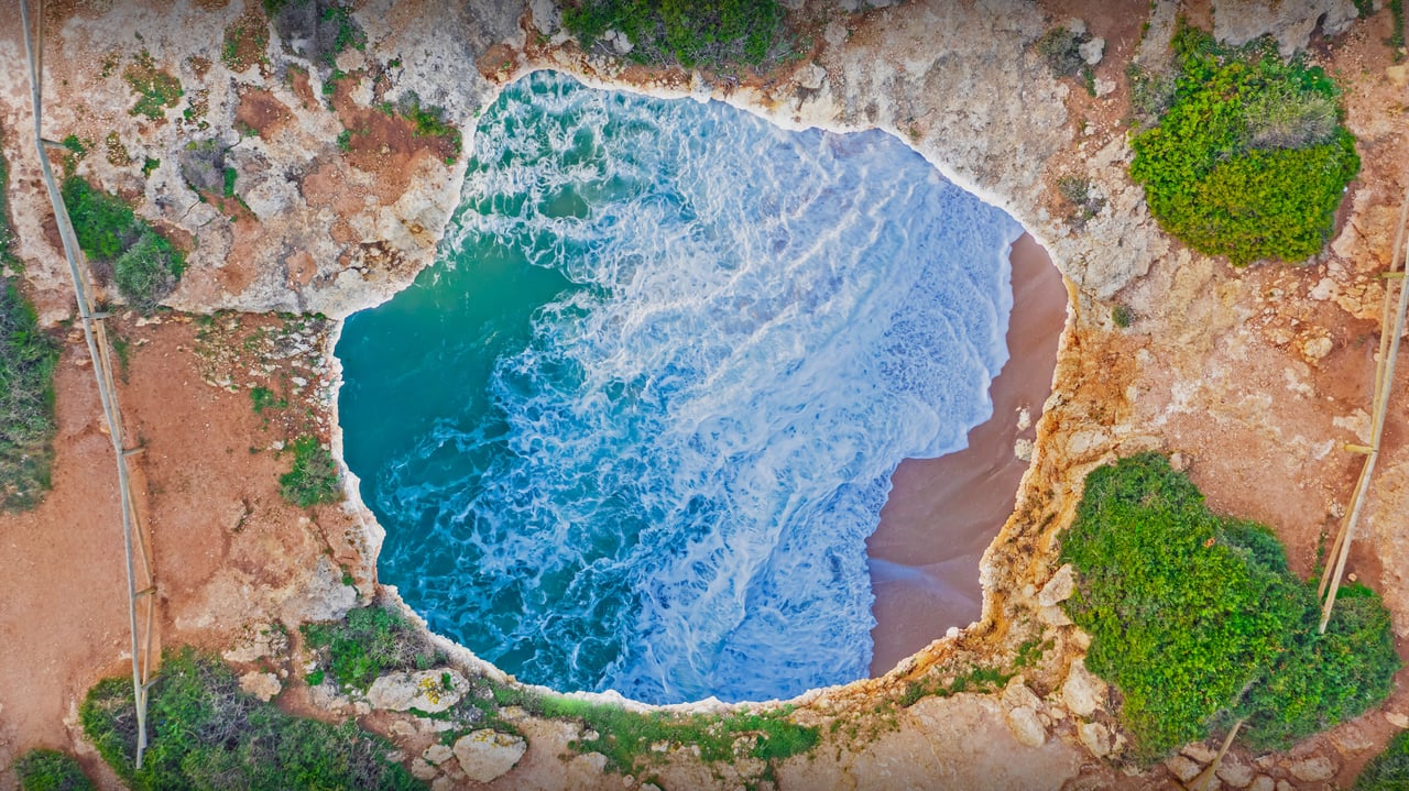 Benagil Cave in the Algarve, Portugal (© Michael Malorny/Offset by Shutterstock) desktop wallpaper