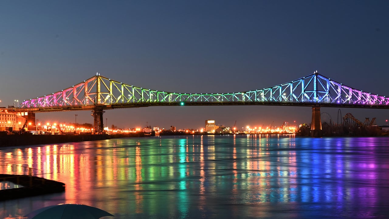 The Jacques Cartier bridge in Montreal is illuminated in the colours of the rainbow as a sign of hope and in support of the victims of the coronavirus (© ERIC THOMAS/AFP via Getty Images) desktop wallpaper