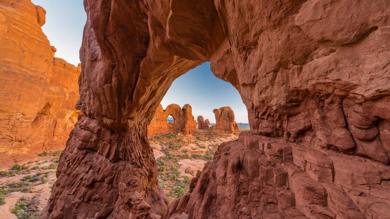 Double Arch seen through Cove Arch, Arches National Park, Utah (© Jeff Foott/Minden Pictures) desktop wallpaper