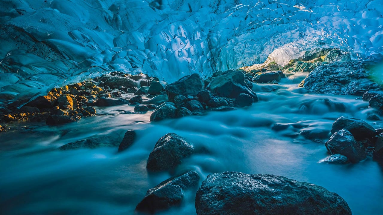 Flowing river inside a glacier cave, Vatnajökull, Iceland (© Marco Bottigelli/Getty Images) desktop wallpaper