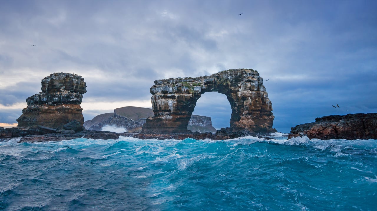 Darwin's Arch with Darwin Island in background, Galápagos, Ecuador (© miralex/Getty Images) desktop wallpaper