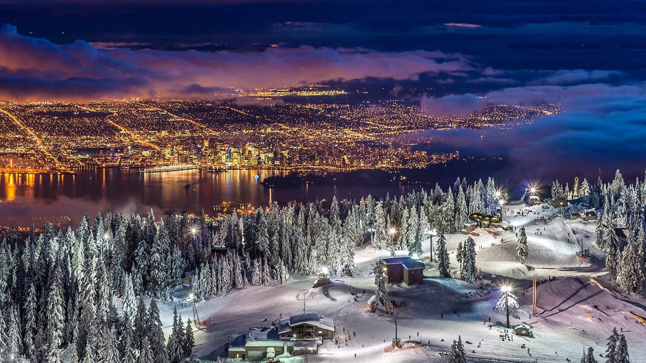 City lights from the snowy peak of Grouse Mountain at twilight, Vancouver (© Pierre Leclerc Photography/Getty Images) desktop wallpaper