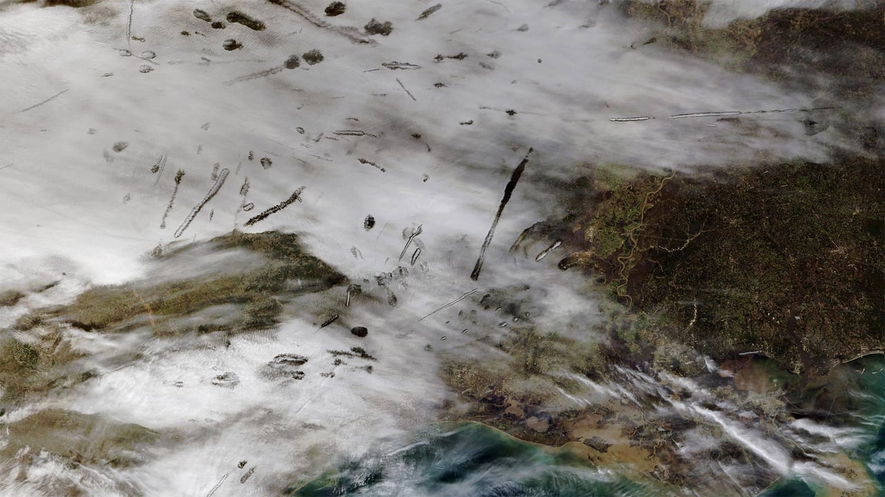 From NASA’s Terra satellite, an image of fallstreak holes in clouds over the southern United States (© NASA) desktop wallpaper