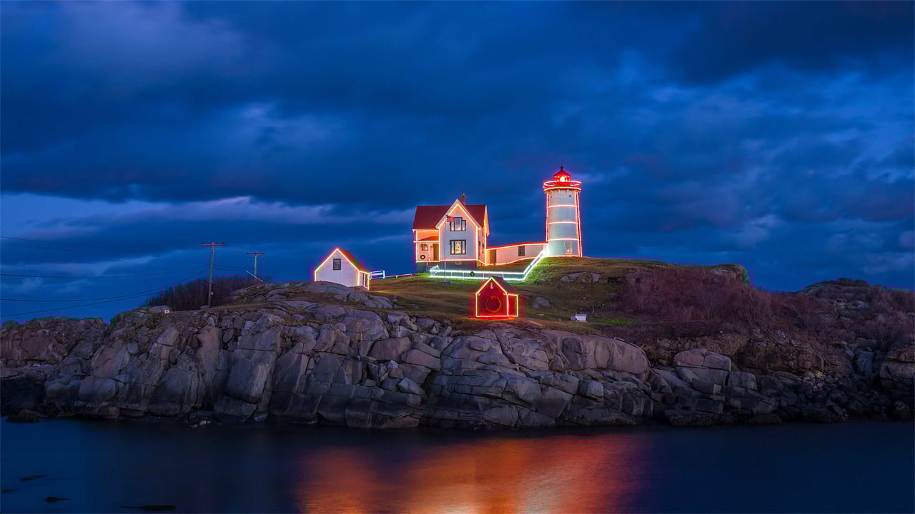Holiday lights on Cape Neddick Light in York, Maine (© Walter Bibikow/Alamy) desktop wallpaper