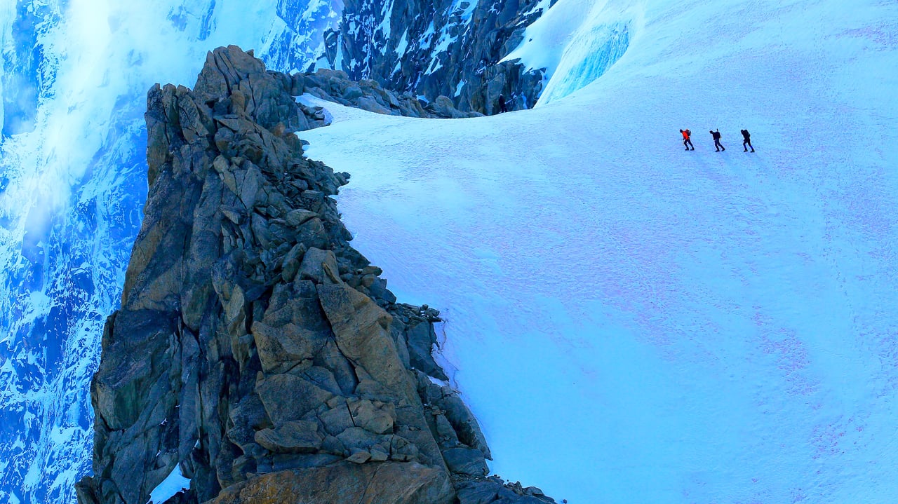 Hikers on alpine glacier, Mont Blanc, Chamonix, France (© agustavop/Getty Images) desktop wallpaper