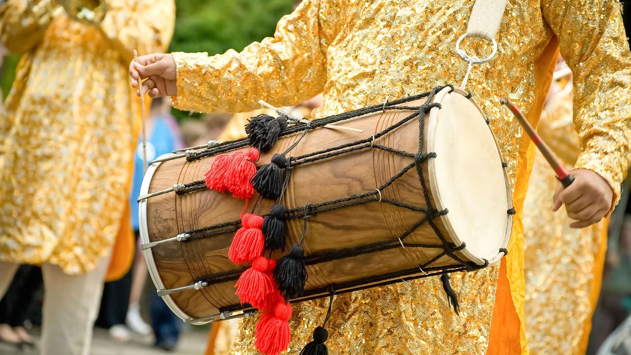 Musician playing a traditional Indian dhol (© Nelson Art/Alamy Stock Photo) desktop wallpaper