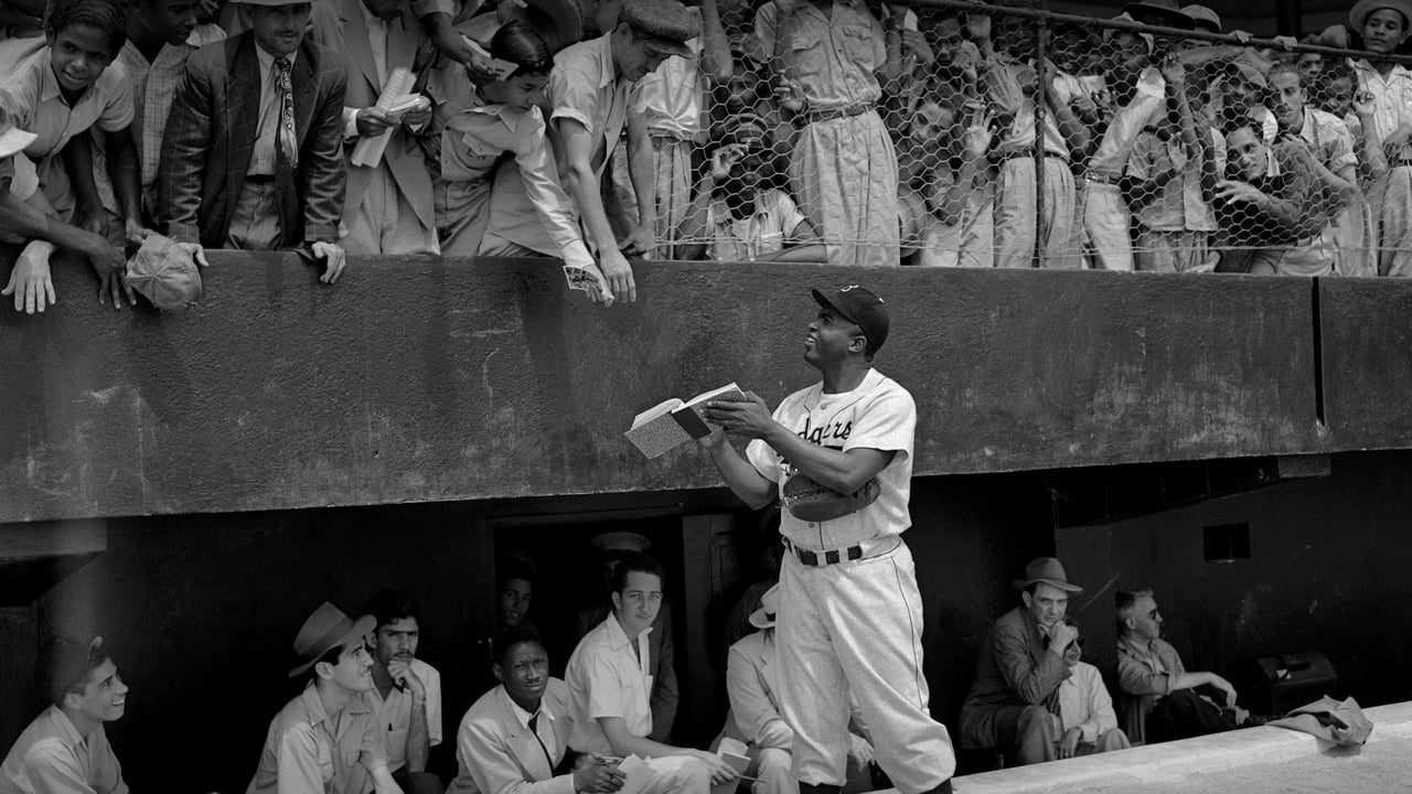 Jackie Robinson signs autographs at spring training in Ciudad Trujillo, now Santo Domingo, Dominican Republic, on March 6, 1948 (© Bettmann/Getty Images) desktop wallpaper