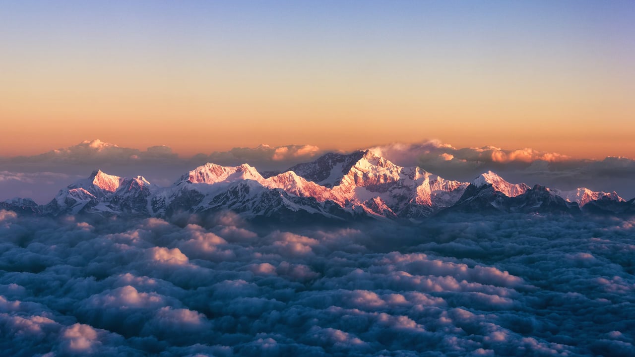 Kanchenjunga, on the India-Nepal border, among a sea of clouds at sunrise (© Alexander W Helin/Getty Images) desktop wallpaper