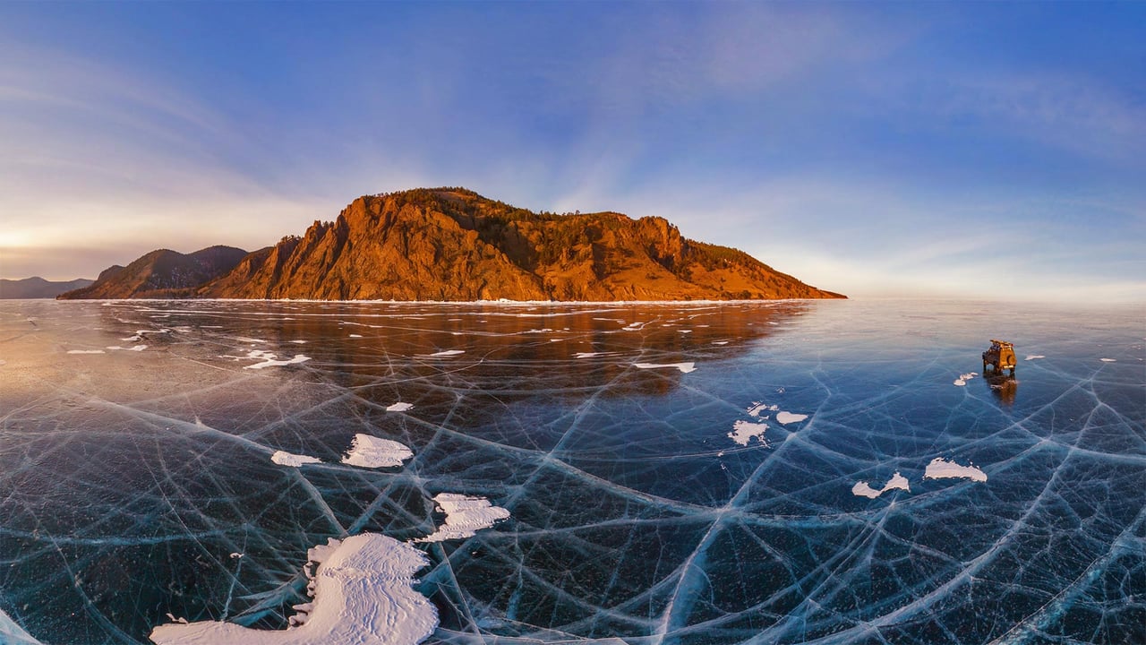 Aerial view of a car crossing over the frozen surface of Lake Baikal, Russia (© Amazing Aerial Agency/Offset) desktop wallpaper