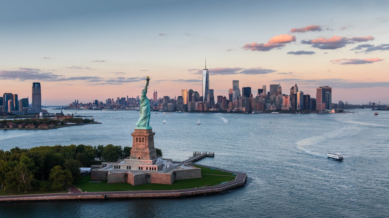 Statue of Liberty and Lower Manhattan, New York City (© Tetra Images/Getty Images) desktop wallpaper