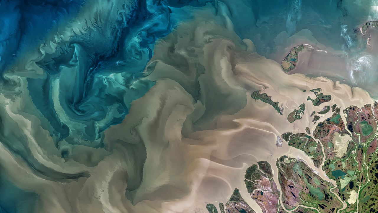 The Mackenzie River in Canada emptying into the Beaufort Sea (© Norman Kuring, GSFC/NASA/USGS Landsat) desktop wallpaper