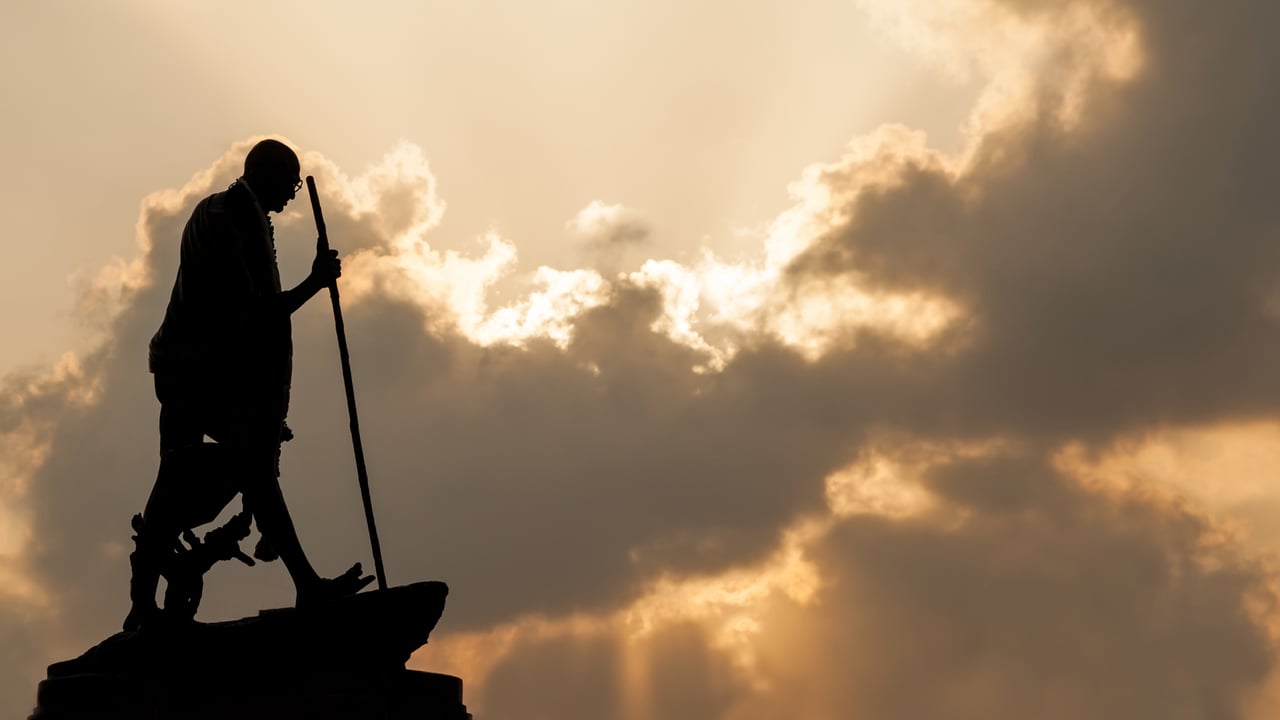 Mahatma Gandhi statue in Chennai at sunset with dramatic sky (© cornfield/Shutterstock) desktop wallpaper