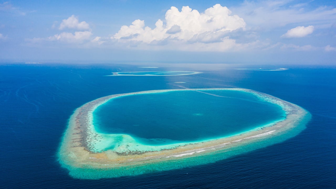 Atolls in Indian Ocean, Maldives (© Amazing Aerial Premium/Shutterstock) desktop wallpaper
