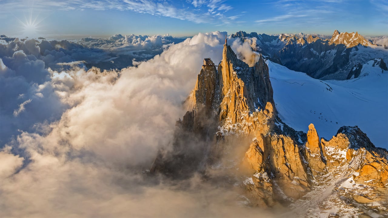 Aerial view of the Aiguille du Midi in the Mont Blanc massif, France (© Amazing Aerial Agency/Offset by Shutterstock) desktop wallpaper