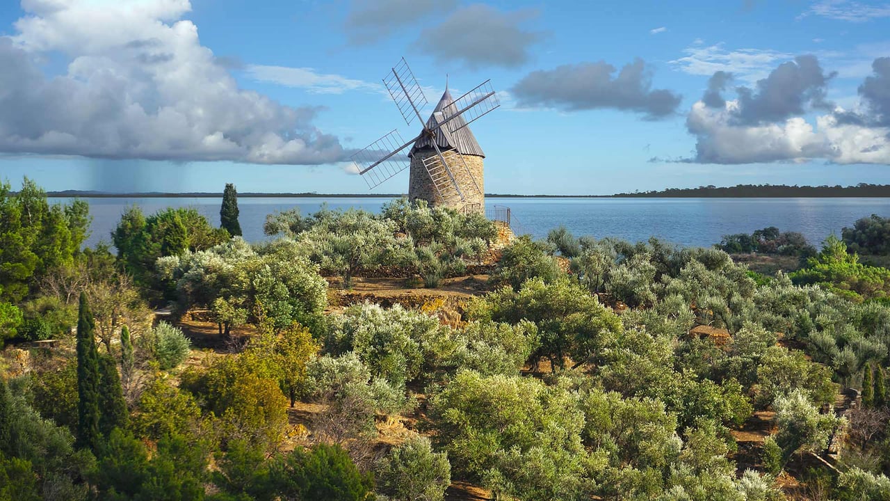 Ancient stone windmill, France (© Damocean/iStock/Getty Images Plus) desktop wallpaper