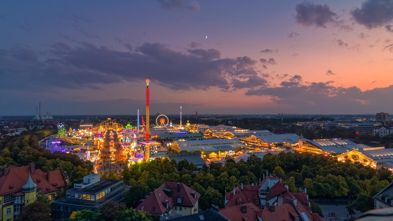 Oktoberfest in Munich, Germany, at sunset (© AllesSuper21/iStock/Getty Images) desktop wallpaper