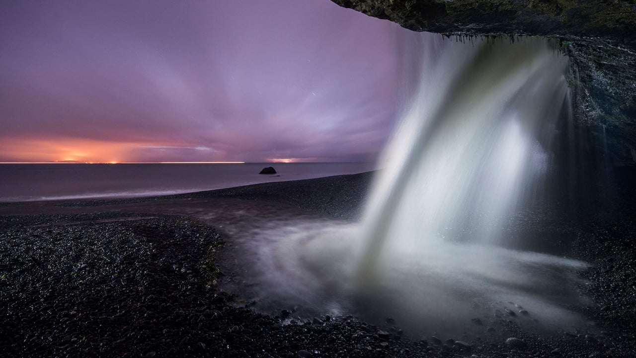 View of a waterfall at Mystic Beach in Juan de Fuca Provincial Park, B.C. during dusk (© DEEPOL/Plainpicture) desktop wallpaper