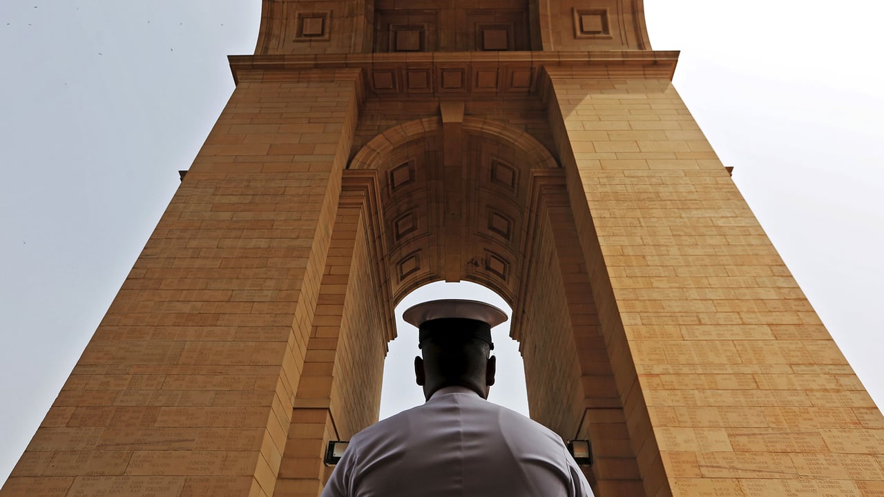 A sailor pays respect at India Gate War Memorial, Delhi. (© Adnan Abid/Reuters) desktop wallpaper