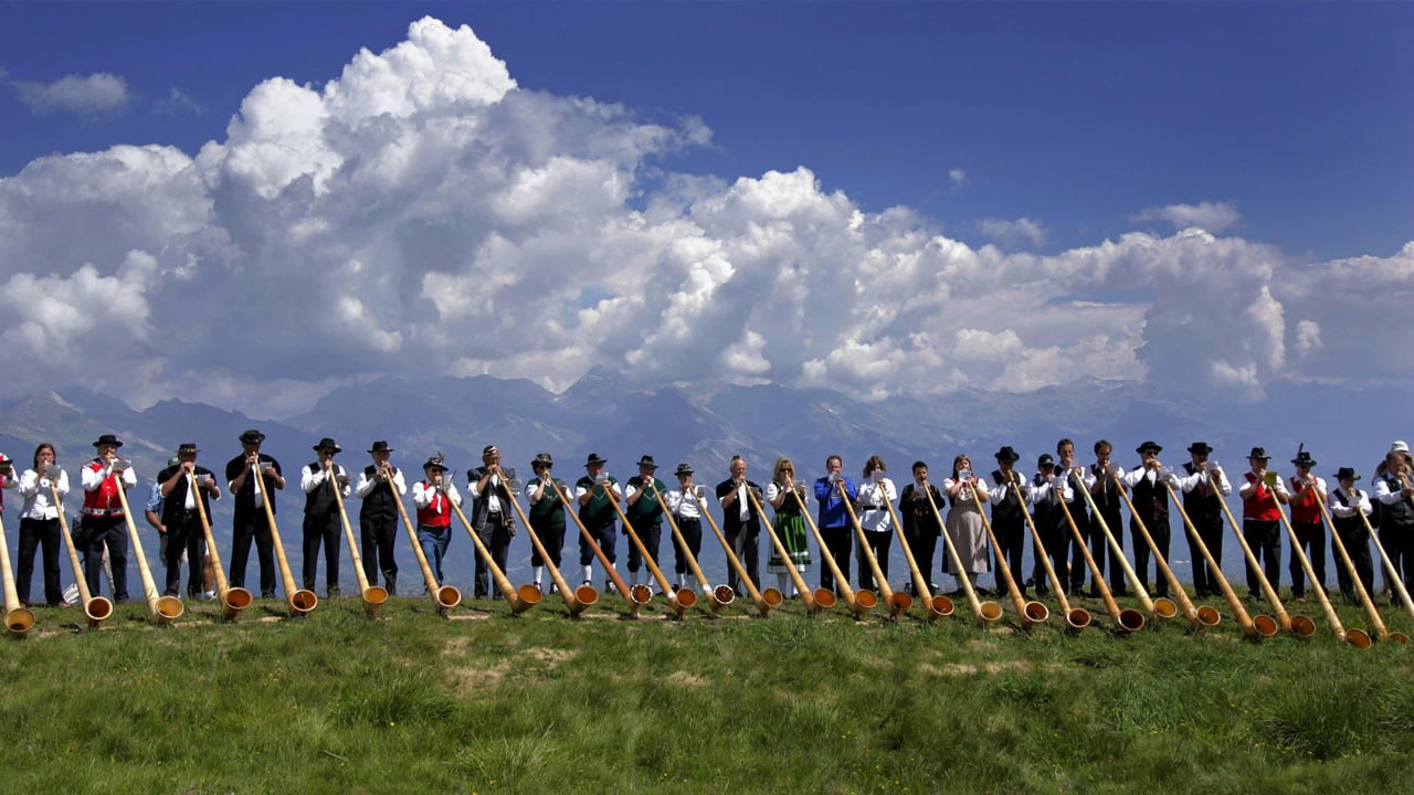 Alphorn musicians perform during the International Alphorn Festival in Nendaz, Switzerland (© Fabrice Coffrini/Getty Images) desktop wallpaper