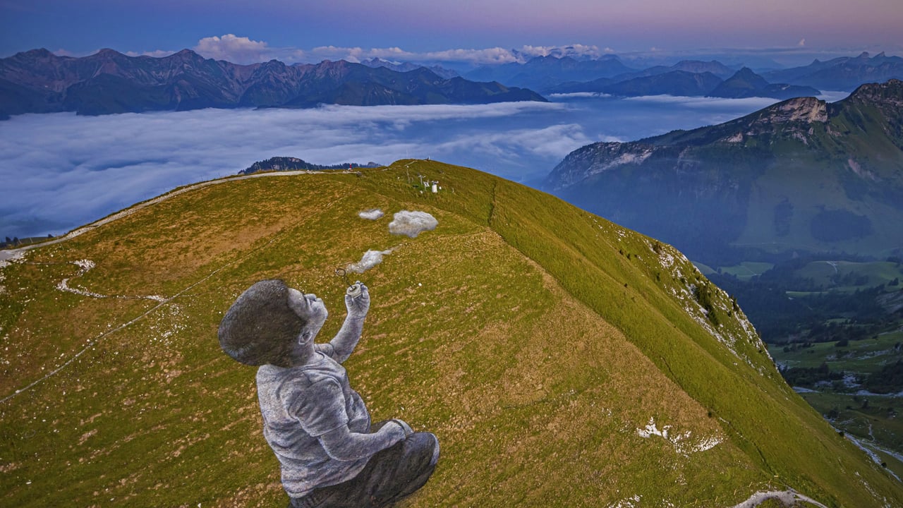 'A New Breath' by artist Saype in Moléson-sur-Gruyères, Switzerland (© Valentin Flauraud/Shutterstock) desktop wallpaper