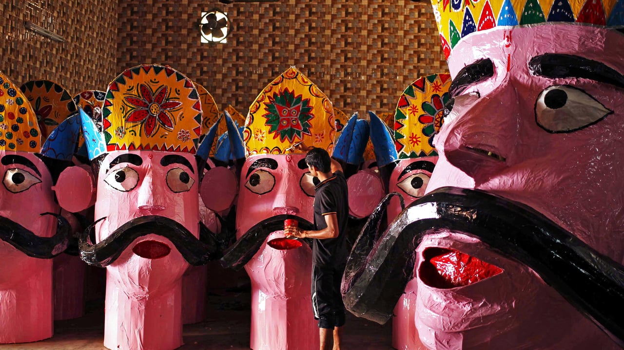 An artisan applies final touches to an effigy of Ravana in Jammu, India (© Mukesh Gupta/Reuters) desktop wallpaper
