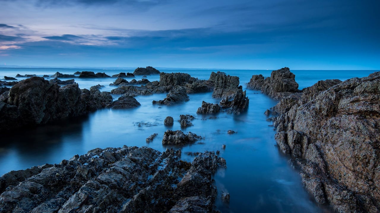 View of the coastline at dusk, Saint Andrews, Fife (© Graham Hutchison/500px/Getty Images) desktop wallpaper