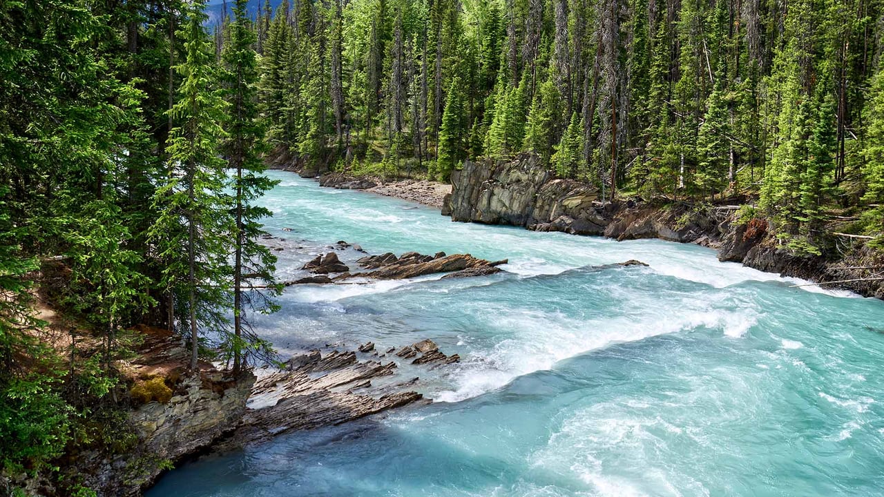 Glacial turquoise water of Kicking Horse River, Yoho National Park, B.C. (© Oleg Charykov/Getty Imgaes) desktop wallpaper