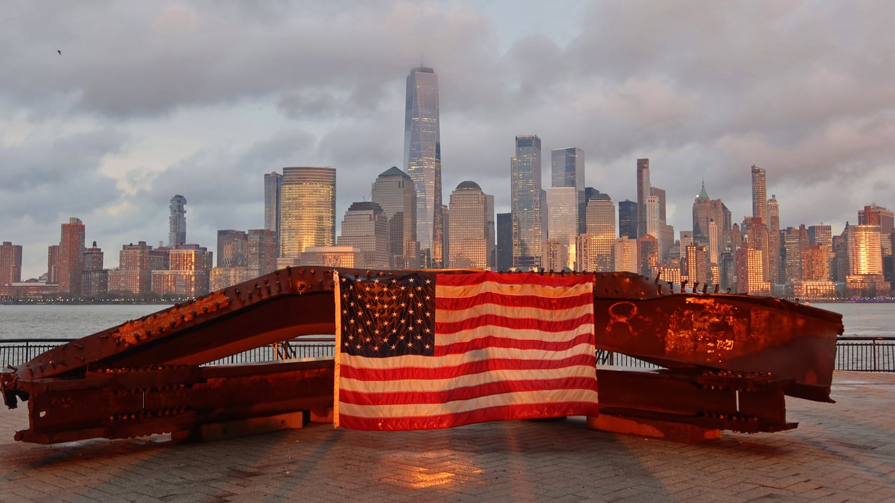 US flag on part of a 9/11 memorial overlooking the New York skyline from Exchange Place, Jersey City, New Jersey (© Gary Hershorn/Getty Images) desktop wallpaper