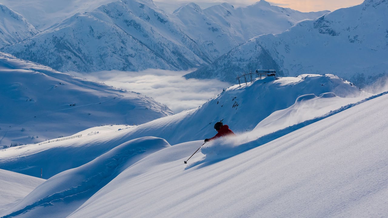 Skier making a turn in pristine snow in Whistler, B.C. (© stockstudioX/Getty Images) desktop wallpaper