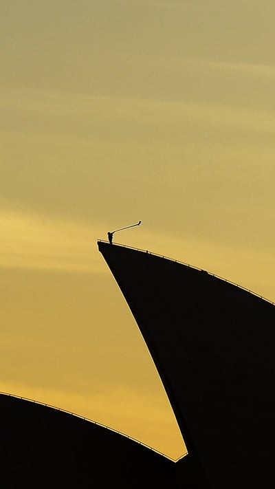 Arkady Shilkloper plays his three-metre-long alphorn atop the Sydney Opera House as part of the 2013 Sydney Festival (© Mark Metcalfe/Getty Images) mobile wallpaper