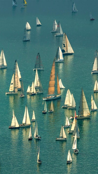 Boats massing for the Barcolana regatta in the Gulf of Trieste, Italy (© Ababsolutum/E+/Getty Images) mobile wallpaper