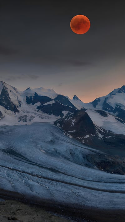 Panoramic view of the Bernina Range with blood moon, Eastern Alps, Engadin, Switzerland (© Bernd Zoller/Shutterstock) mobile wallpaper