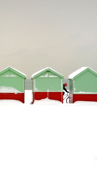 Beach huts covered in snow in Brighton and Hove, England (© Tim Jones/Alamy) mobile wallpaper