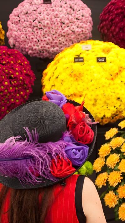 A woman with a floral hat at the RHS Chelsea Flower Show 2014 (© Bettina Strenske/Alamy Stock Photo) mobile wallpaper
