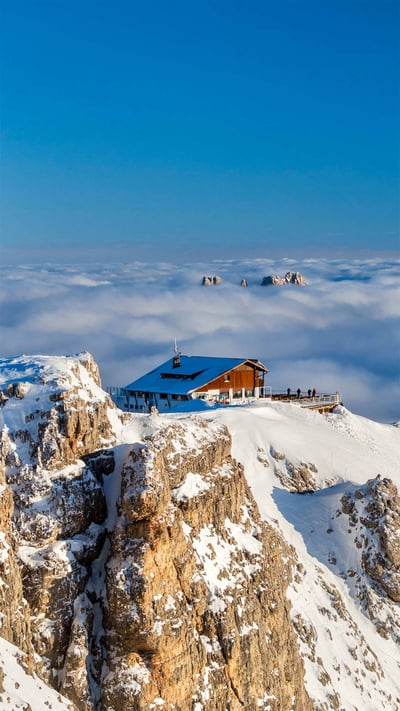 Rifugio Lagazuoi above the clouds with Monte Pelmo in the background, Dolomites, Italy (© Nicolo Miana/eStock Photo) mobile wallpaper