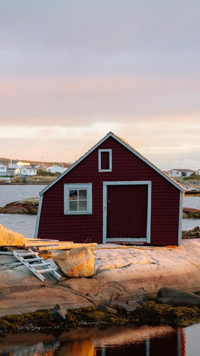 Small red house on the rocky coast of St. John's, Newfoundland and Labrador (© Jessie Brinkman Evans/Offset) mobile wallpaper