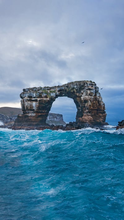 Darwin's Arch with Darwin Island in background, Galápagos, Ecuador (© miralex/Getty Images) mobile wallpaper