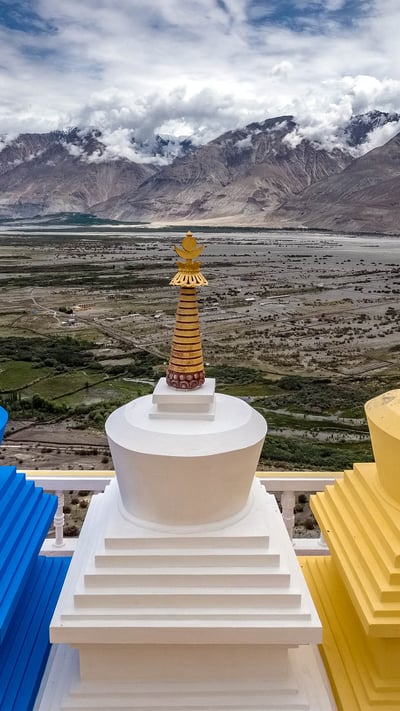 Three stupa with Nubra Valley in the background in Ladakh, India (© Puripat Lertpunyaroj/Getty Images) mobile wallpaper