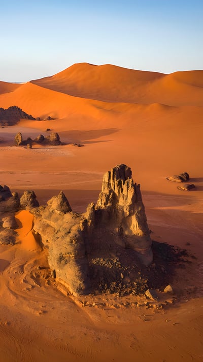 Rock formations and sand dunes in the Sahara, Tassili n’Ajjer, Algeria (© Airpano/Amazing Aerial Agency) mobile wallpaper