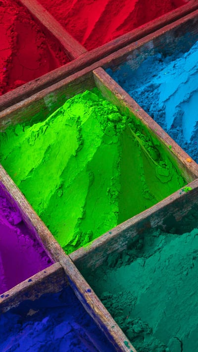 Brightly colored powder for sale during Holi (© Max Bauerfeind/Shutterstock) mobile wallpaper