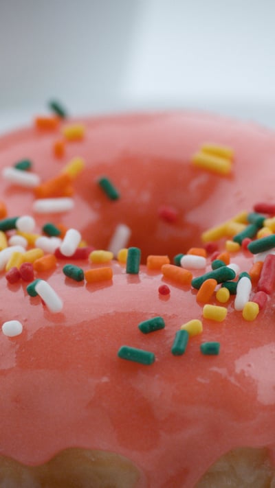 A glazed doughnut with sprinkles (© viafilms/Getty Images) mobile wallpaper