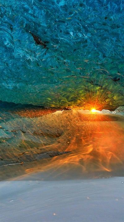 Ice cave at sunset in Vatnajökull National Park, Iceland (© Johnathan Ampersand Esper/Aurora Photos) mobile wallpaper