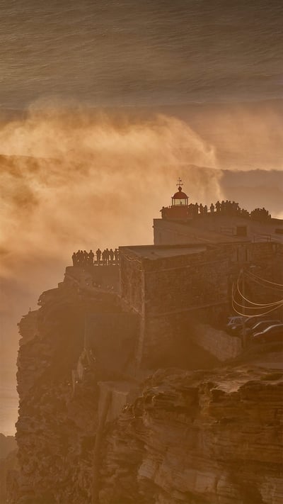 Nazaré Lighthouse atop Forte de São Miguel Arcanjo, Nazaré, Portugal (© Richard A Lock/Getty Images) mobile wallpaper