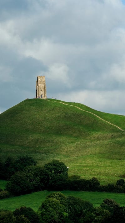 Glastonbury Tor and St. Michael's Tower in England for the start of the Glastonbury Festival (© Spraggon Photography/Getty Images Plus) mobile wallpaper