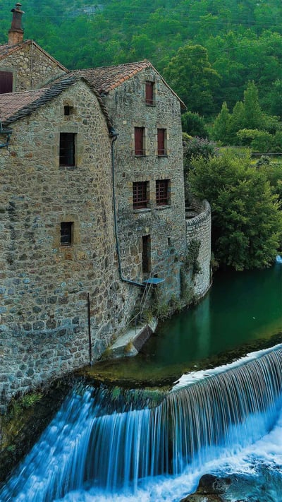 The Dourbie Gorge Corps Mill and adjoining bridge in Grands Causses Regional Nature Park, France (© Hemis/Alamy) mobile wallpaper
