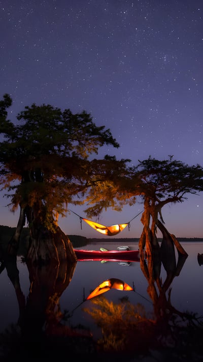 Hammock camping on a lake in Central Florida (© Mac Stone/Tandem Stills + Motion) mobile wallpaper