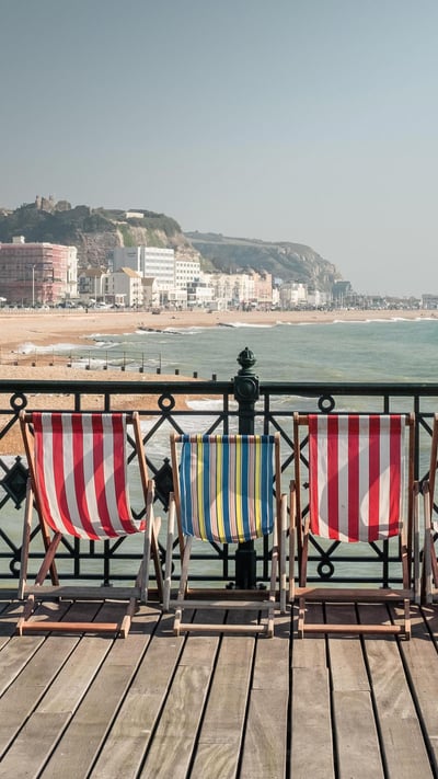 Deckchairs on Hastings Pier, East Sussex, England (© ams images/Alamy) mobile wallpaper
