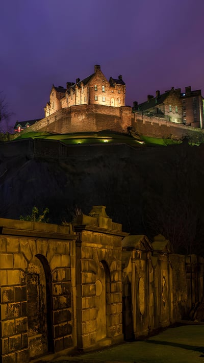 View of Edinburgh Castle from a churchyard in Scotland (© Chris Dorney/Alamy) mobile wallpaper